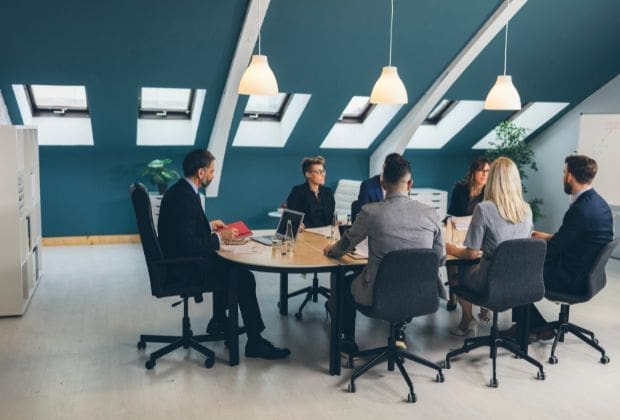 Business meeting in a modern office setting.